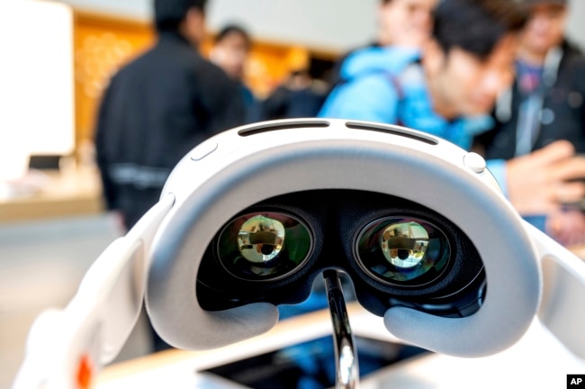 An Apple Vision Pro headset rests on display during the first day of sales at a Palo Alto, Calif., Apple store on Friday, Feb. 2, 2024. (AP Photo/Noah Berger)