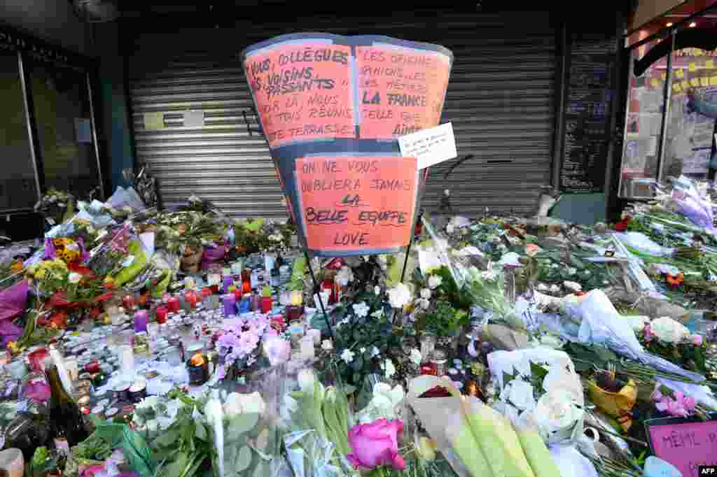 Flowers, candles and messages left as a memorial outside of La Belle Equipe bar, in the 11th district of Paris, following a series of coordinated terrorists attacks on November 13. 