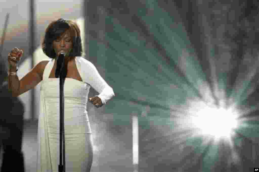 In this Nov. 22, 2009, file photo, Whitney Houston performs at the 37th Annual American Music Awards in Los Angeles. Houston died Saturday, Feb. 11, 2012, she was 48. (AP Photo/Matt Sayles)