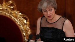 FILE - Britain's Prime Minister Theresa May speaks at the Lord Mayor's Banquet at the Guildhall, in London, Britain, Nov. 13, 2017.