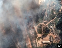 Vista general de las consecuencias de una gran serie de explosiones en un depósito de municiones en Toropets, Rusia, el miércoles 18 de septiembre de 2024. (Imagen satelital ©2023 Maxar Technologies vía AP)