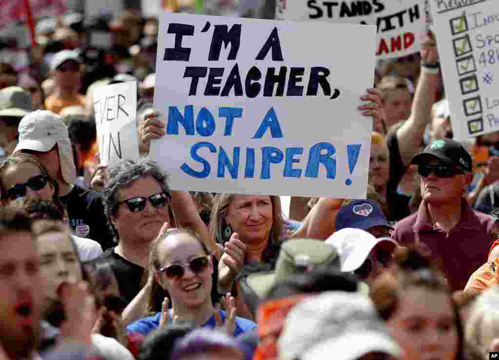 People participate in a &quot;March For Our Lives&quot; rally at the state Capitol, Saturday, March 24, 2018, in Phoenix. (AP Photo/Matt York)