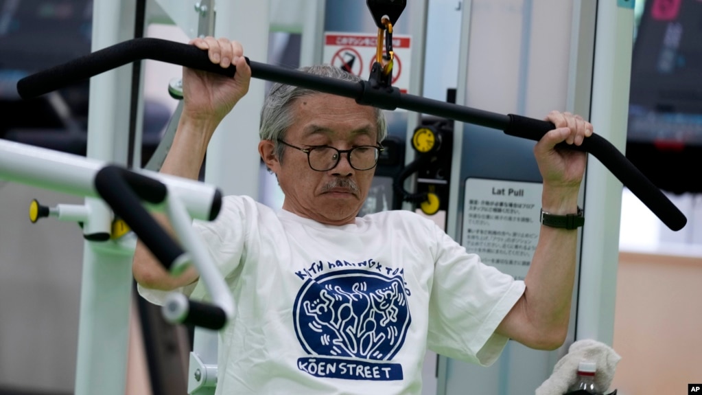 Toshiyuki Honma, 70, uses a lat pulldown machine as he works out at the Fukagawa Sports Center in Tokyo, Wednesday, June 12, 2024. If you are getting up there in years, weight-resistance training might deliver unexpected benefits. (AP Photo/Hiro Komae)