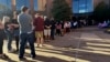 Voters line up outside the Bucks County Administration Building during early voting in the general election, Nov. 1, 2024, in Doylestown, Pa. 