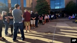 Voters line up outside the Bucks County Administration Building during early voting in the general election, Nov. 1, 2024, in Doylestown, Pa. 