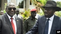 FILE - South Sudan's First Vice President Riek Machar, left, and President Salva Kiir are pictured after the first meeting of a new transitional coalition government, in the capital, Juba, April 29, 2016. 