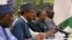 Nigerian President Muhammadu Buhari, second left, talks with Chinese officials during a meeting at the Great Hall of the People in Beijing, April 13, 2016.