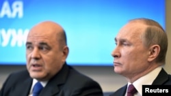Le président russe Vladimir Poutine et le premier ministre désigné Mikhaïl Michoustine