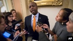 Sen. Tim Scott, R-S.C., talks to reporters about his plan to meet with President Donald Trump to discuss race and Trump's widely criticized response to last month's protests and racial violence in Charlottesville, Virginia, in Washington, Sept. 13, 2017. 