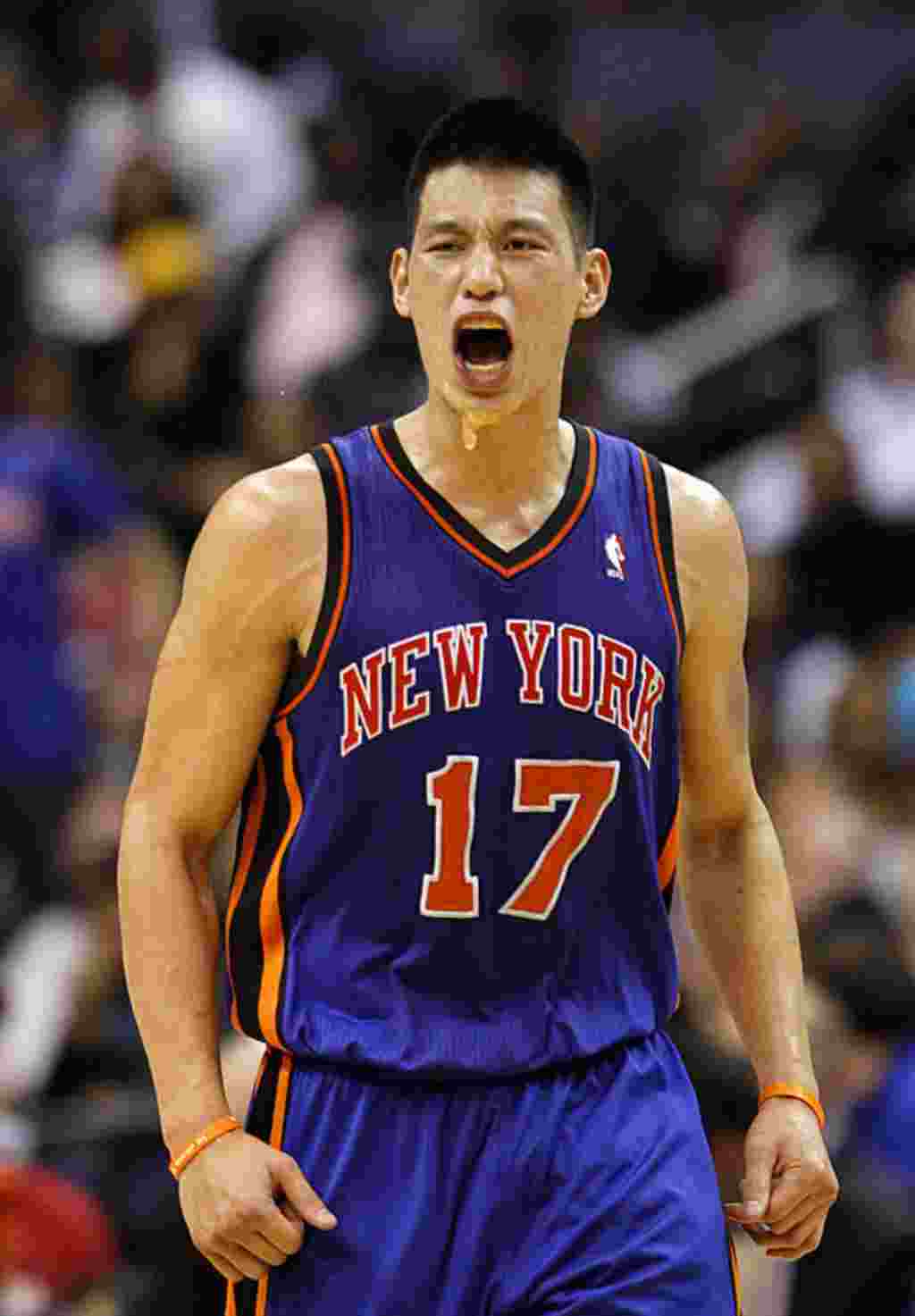 New York Knicks point guard Jeremy Lin celebrates his dunk during the second half of an NBA basketball game against the Washington Wizards, February 8, 2012, in Washington. The Knicks won 107-93. (AP)