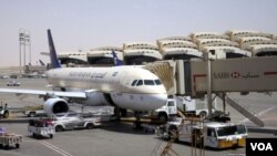 A Saudi Arabian Airlines A320 is parked at the King Khalid International Airport, Riyadh 