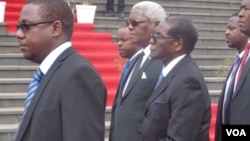 President Robert Mugabe with some state officials.
