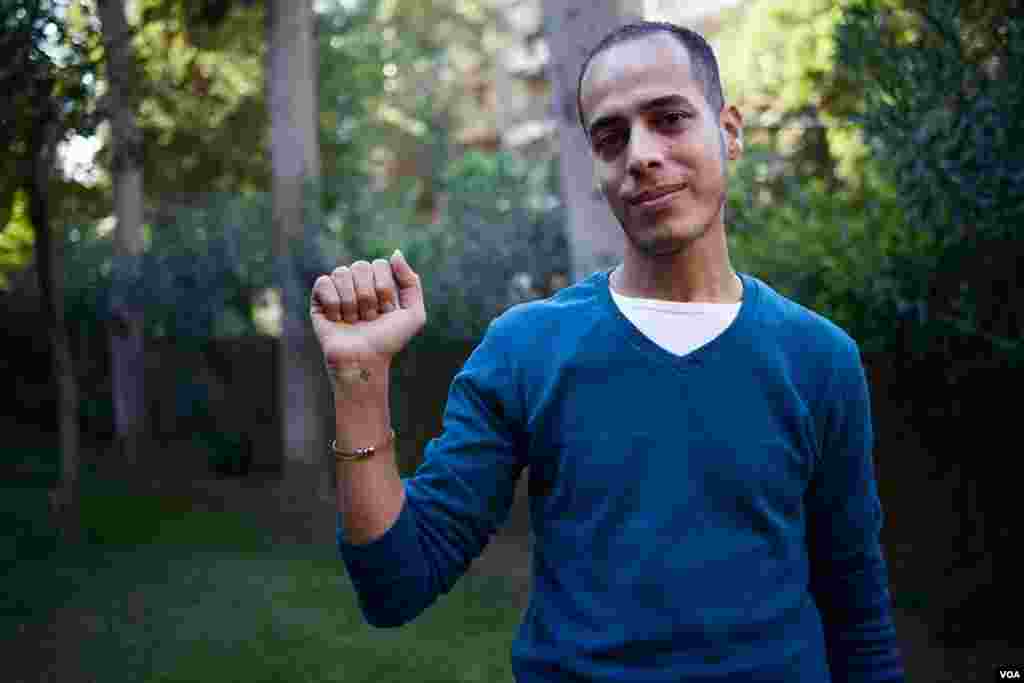 Former Christian Milad Soliman says he became an atheist after he entered university. He still has a small Coptic cross tattooed&nbsp;on his wrist, Oct. 25, 2013, Cairo. (Yuli Weeks for VOA)