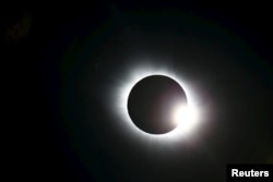 A total solar eclipse occurs over Svalbard in the Arctic Ocean, March 20, 2015.