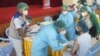 မန္တလေးတိုင်းဒေသကြီး၊ မန္တလေးမြို့တော်ခန်းမမှာ ကျန်းမာရေးဝန်ထမ်းများကို ကိုဗစ်ကာကွယ်ဆေး ထိုးနှံပေးနေတဲ့ မြင်ကွင်း။ (ဓာတ်ပုံ -Ministry of Health and Sports, Myanmar - ဇန်နဝါရီ ၂၇၊ ၂၀၂၁) 