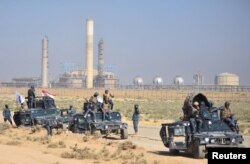 Members of Iraqi federal forces gather near oil fields in Kirkuk, Iraq, Oct. 16, 2017. (Reuters)