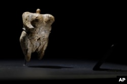 In this June 27, 2017 photo the 'Venus of Hohle Fels' figure is pictured in the Prehistory Museum in Blaubeuren, Germany. The 40,000 years old ivory Venus figurine is considered the oldest example of human figurative prehistoric art.