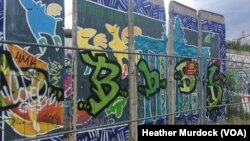 FILE - Remnants of the Berlin Wall remain in the city, serving as a reminder of dark days in Europe, June 30, 2016.