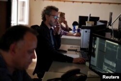 Journalists of Hungarian broadsheet daily Magyar Nemzet, that will close its operations on Wednesday after 80 years in print, work on the last edition in Budapest, Hungary Aprill 10, 2018.