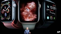 Jeff Williams, Apple's chief operating officer, speaks about the Apple Watch Series 4 at the Steve Jobs Theater during an event to announce new Apple products Wednesday, Sept. 12, 2018, in Cupertino, Calif. (AP Photo/Marcio Jose Sanchez)