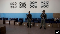 Venezuelan Bolivarian National Guard officers guard voting machines at a polling station, in Caracas, Venezuela, May 18, 2018.