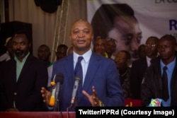 FILE - Emmanuel Ramazani Shadary, nominated by President Joseph Kabila for the presidential election scheduled for December 23, speaks at a rally in Kinshasa, Sept. 25, 2018.