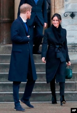 FILE - In this Jan.18, 2018 photo, Britain's Prince Harry and his fiancee Meghan Markle leave after a visit to Cardiff Castle in Cardiff.