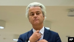 FILE - Populist anti-Islam lawmaker Geert Wilders prepares to address judges at the high-security court near Schiphol Airport, Amsterdam.