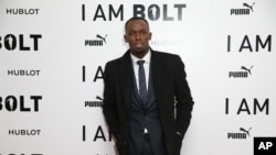 Sprinter Usain Bolt, who has won nine Olympic gold medals, poses for photographers upon arrival at the World premiere of the film 'I Am Bolt' in London, Nov. 28, 2016.