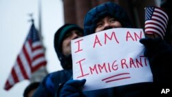 Demonstrators gather in solidarity against President Donald Trump's executive order temporarily banning immigrants from seven Muslim-majority countries from entering the U.S. and suspending the nation’s refugee program Jan. 30, 2017, outside City Hall in 