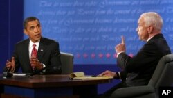 FILE - Democratic presidential candidate Sen. Barack Obama, D-Ill., and Republican presidential candidate Sen. John McCain, R-Ariz., talk during the presidential debate Wednesday, Oct. 15, 2008, at Hofstra University in Hempstead, N.Y. (AP Photo/Gary Hershorn, Pool)