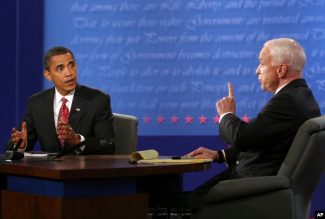FILE - Democratic presidential candidate Sen. Barack Obama, D-Ill., and Republican presidential candidate Sen. John McCain, R-Ariz., talk during the presidential debate Wednesday, Oct. 15, 2008, at Hofstra University in Hempstead, N.Y.