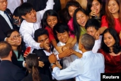 FILE - Youths reach to shake hands with U.S. President Barack Obama after his speech at a YSEALI (Young Southeast Asian Leaders Initiative) town hall at Yangon University in Yangon, Nov. 14, 2014.