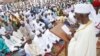 FILE - Nigeria Muslims listen to the sermon by Imam Bashir Umar, during Eid al-Fitr prayers in Lagos, Nigeria, to mark the end of the month of Ramadan, June 25, 2017.