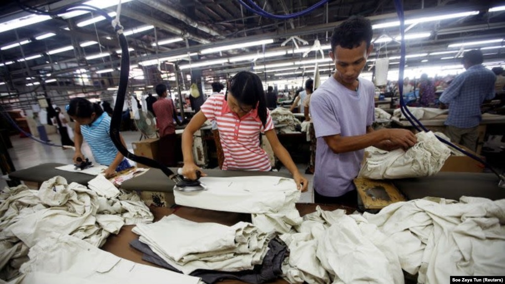 FILE - Workers iron and arrange clothing at a garment factory at Hlaing Taryar industrial zone in Yangon, March 10, 2010. (REUTERS/Soe Zeya Tun/File Photo)