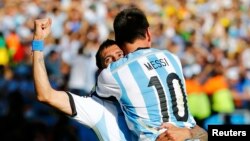 Argentina's Angel Di Maria celebrates after scoring a goal with teammate Lionel Messi during extra time in their 2014 World Cup round of 16 game against Switzerland at the Corinthians arena in Sao Paulo, July 1, 2014.
