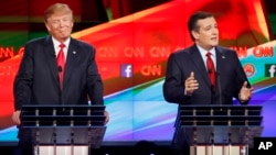 Ted Cruz, right, makes a point as Donald Trump reacts during the CNN Republican presidential debate at the Venetian Hotel & Casino on Dec. 15, 2015, in Las Vegas.