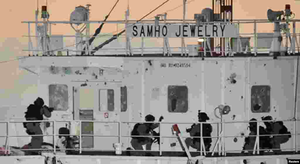 South Korean naval special forces take up positions during an operation to rescue crew members on the Samho Jewelry vessel in the Arabian Sea, Jan. 21, 2011.