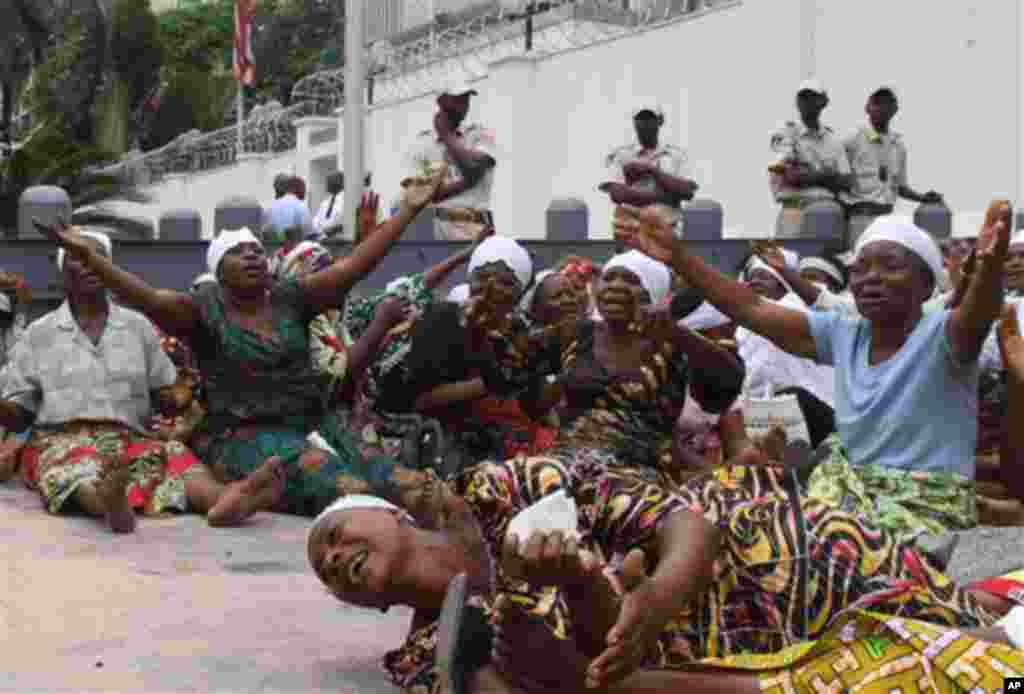 In this Monday, Dec. 19, 2011 photo, women supporters of opposition leader Etienne Tshisekedi protest the results of Congo's recent presidential election outside the United States embassy in Kinshasa, Congo. Incumbent president Joseph Kabila, who was swor