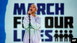 Ariana Grande performs "Be Alright" during the "March for Our Lives" rally in support of gun control, Saturday, March 24, 2018, in Washington. (AP Photo/Alex Brandon)