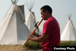 Ojibwe flutist Darren Thompson . Photo by Matt Kelly