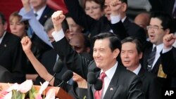 Taiwan's President Ma Ying-jeou cheers with the audience during National Day celebrations marking the 103rd anniversary of the founding of the Republic of China in Taipei, Taiwan, Friday, Oct. 10, 2014.