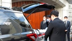 Officials move the body of former South Korean President Chun Doo-hwan from his house to a funeral hall in Seoul, South Korea, Nov. 23, 2021.