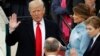 Donald Trump is sworn in as the 45th president of the United States by Chief Justice John Roberts as Trump's wife, Melania, and his son Barron look on the West front of the U.S. Capitol in Washington, Jan. 20, 2017. 