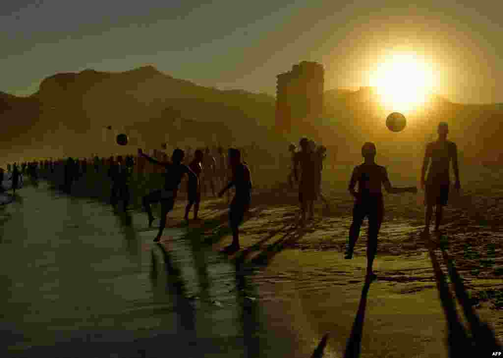 Beachgoers play with balls at Ipanema Beach in Rio de Janeiro, Brazil, June 29, 2019.