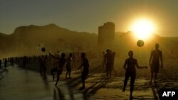 Beachgoers play with balls at Ipanema Beach in Rio de Janeiro, Brazil, on June 29, 2019. 