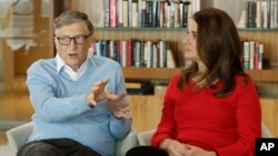 In this Feb. 1, 2018 file photo, Microsoft co-founder Bill Gates and his wife Melinda take part in an AP interview in Kirkland, Wash. (AP Photo/Ted S. Warren, file)