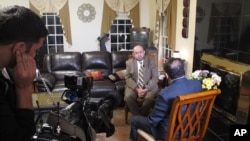 Dr. Mohammad Abu-Salha, whose two daughters and son-in-law were killed last February by a disgruntled neighbor, speaks with an Al Jazeera America crew in Raleigh, N.C., about growing anti-Muslim sentiment in his adopted country, Dec. 9, 2015.