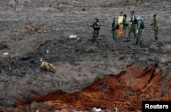 Israeli military personnel search for victims of a collapsed tailings dam owned by Brazilian mining company Vale SA, in Brumadinho, Brazil, Jan. 30, 2019.