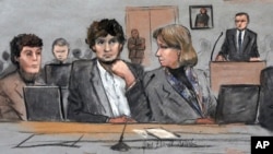 In this courtroom sketch, Dzhokhar Tsarnaev, center, is depicted between defense attorneys Miriam Conrad, left, and Judy Clarke, right, during his federal death penalty trial, March 5, 2015, in Boston. 